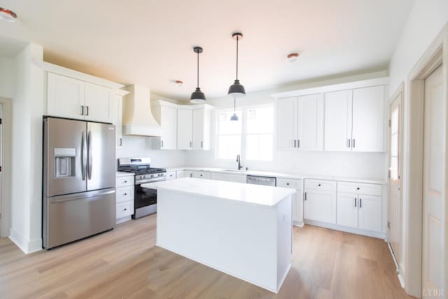 917 Elmwood Ave, Lynchburg, VA 24503 - kitchen featuring appliances with stainless steel finishes, custom range hood, backsplash, and white cabinetry