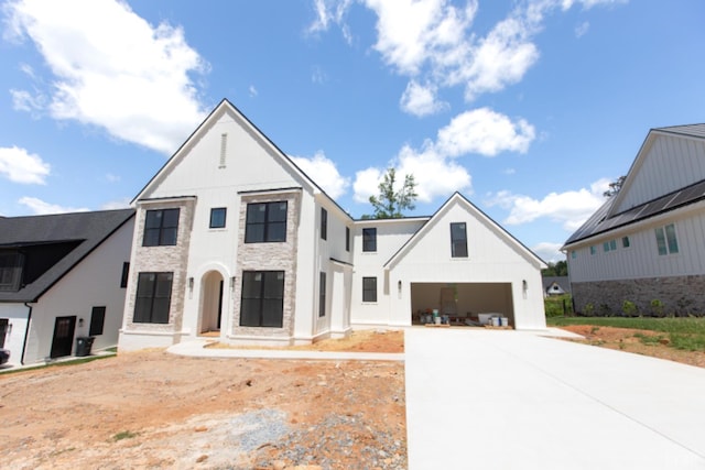 917 Elmwood Ave, Lynchburg, VA 24503 - view of front of house featuring driveway, board and batten siding, and stone siding