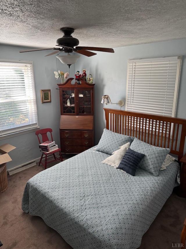 101 Mountain View Dr, Lynchburg, VA 24502 - bedroom featuring a textured ceiling, carpet floors, a baseboard radiator, baseboards, and ceiling fan