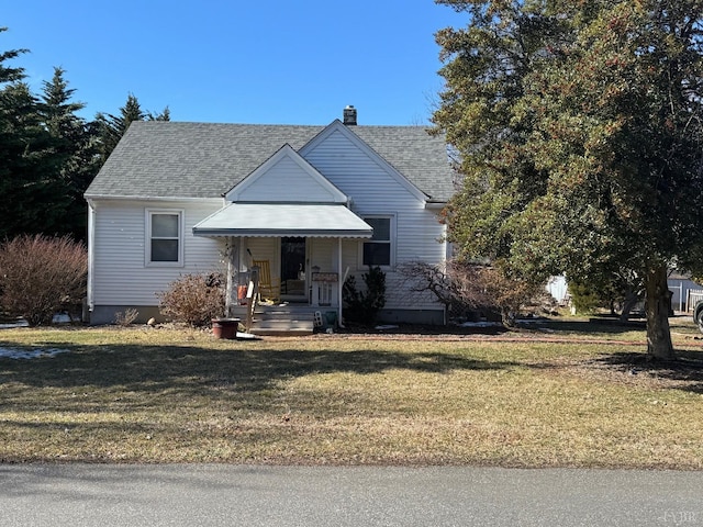 bungalow-style house with a front lawn, a chimney, and a shingled roof