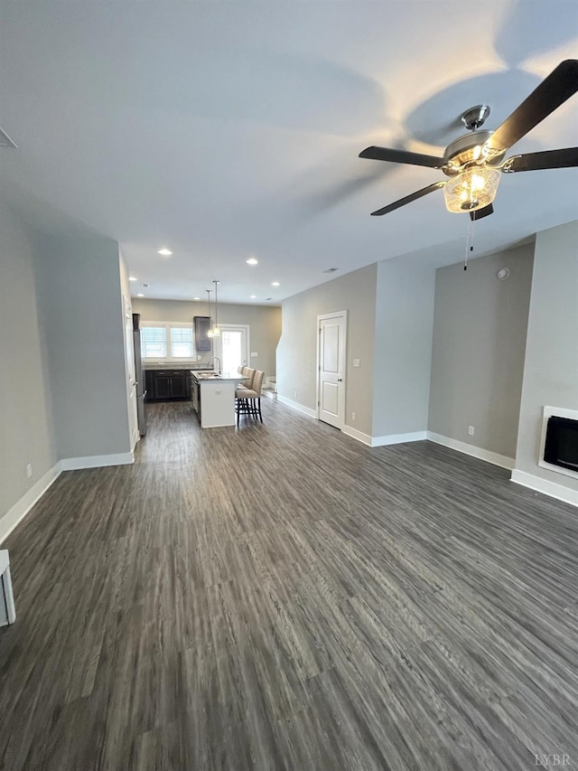 67 Warwick Dr, Lynchburg, VA 24501 - unfurnished living room featuring dark wood-type flooring, ceiling fan, and heating unit