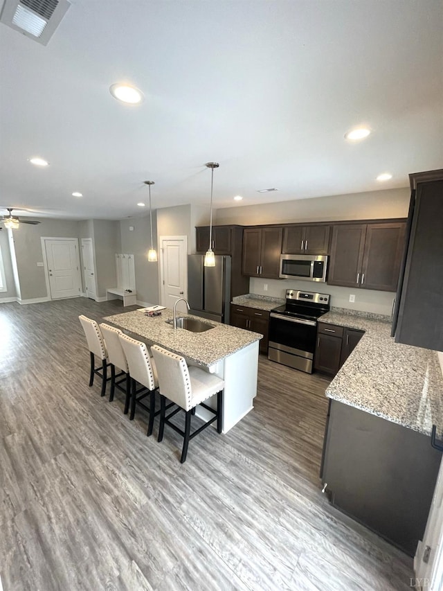 67 Warwick Dr, Lynchburg, VA 24501 - kitchen featuring sink, hanging light fixtures, appliances with stainless steel finishes, and light stone counters