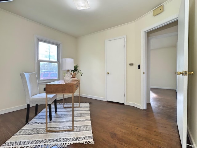 office space featuring baseboards, ornamental molding, and dark wood finished floors