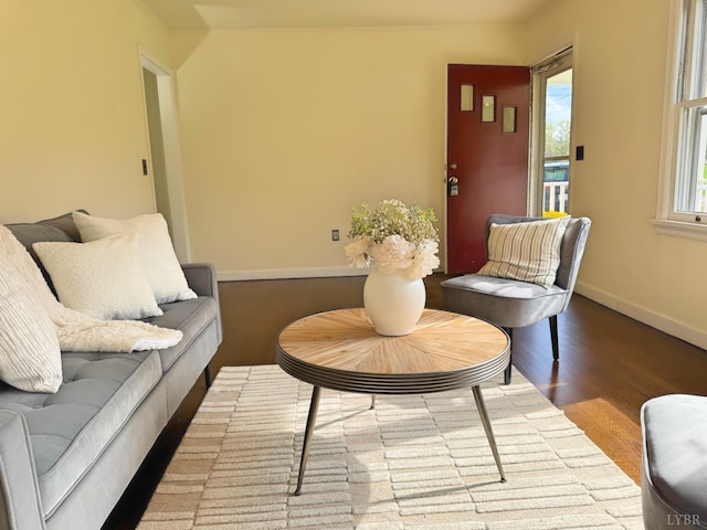 living room featuring baseboards and wood finished floors