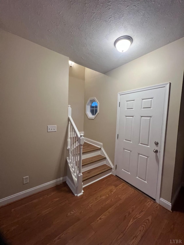 118 Logan Ln, Lynchburg, VA 24502 - entryway featuring wood finished floors, a textured ceiling, and stairs