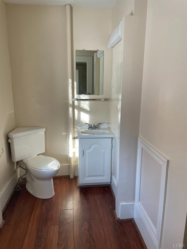 307 Stafford St, Lynchburg, VA 24501 - half bath with baseboards, wood finished floors, vanity, and toilet