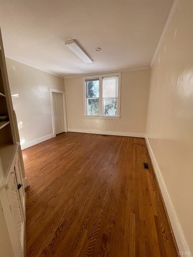 307 Stafford St, Lynchburg, VA 24501 - empty room with baseboards, wood finished floors, visible vents, and crown molding