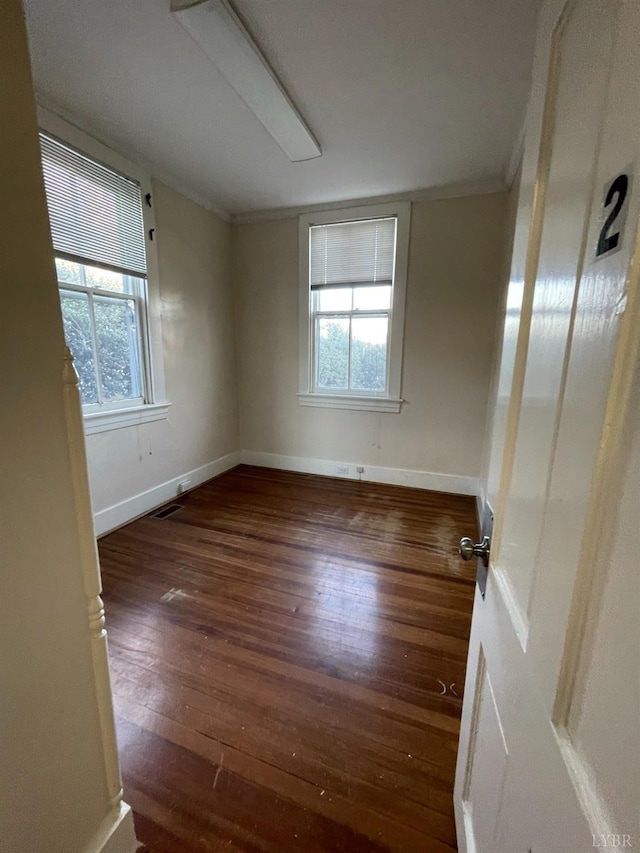 307 Stafford St, Lynchburg, VA 24501 - empty room with a wealth of natural light, crown molding, hardwood / wood-style floors, and baseboards