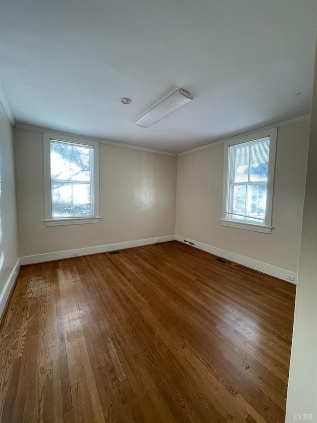 307 Stafford St, Lynchburg, VA 24501 - unfurnished room featuring baseboards, dark wood-style flooring, and crown molding