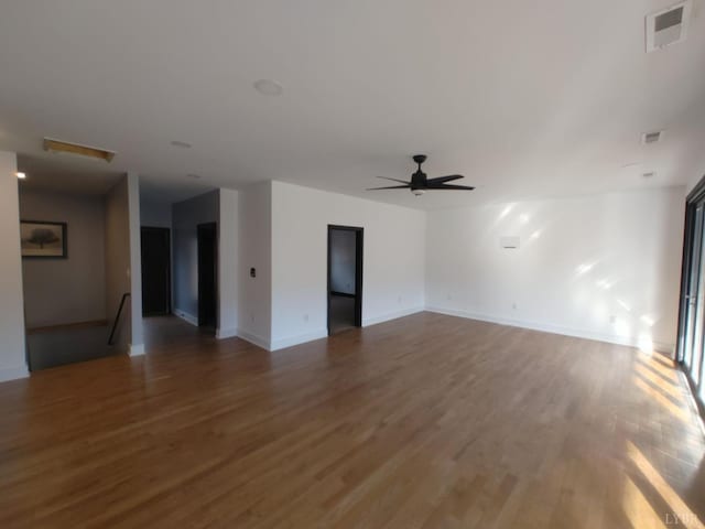 8915 Charlemont Rd, Goode, VA 24556 - unfurnished living room with wood finished floors, ceiling fan, and baseboards