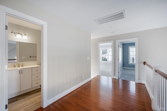 4802 Old Boonsboro Rd, Lynchburg, VA 24503 - corridor with wood finished floors, baseboards, and a sink