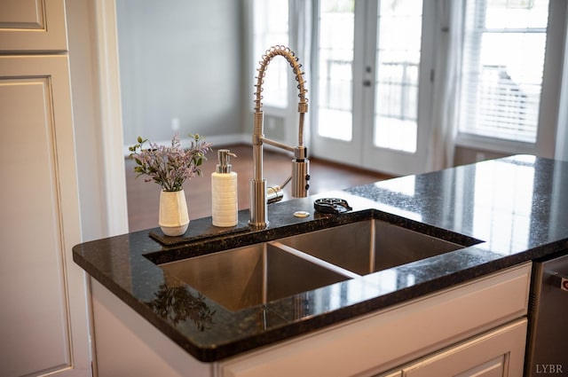 4802 Old Boonsboro Rd, Lynchburg, VA 24503 - kitchen view of a sink, dark stone countertops, white cabinetry, and french doors