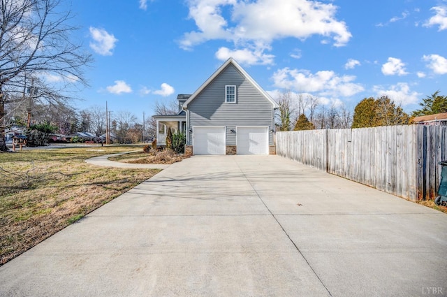 4802 Old Boonsboro Rd, Lynchburg, VA 24503 - view of home's exterior with an attached garage, fence, and concrete driveway
