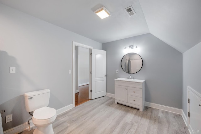 4802 Old Boonsboro Rd, Lynchburg, VA 24503 - bathroom featuring wood finished floors, vanity, lofted ceiling, toilet, and baseboards