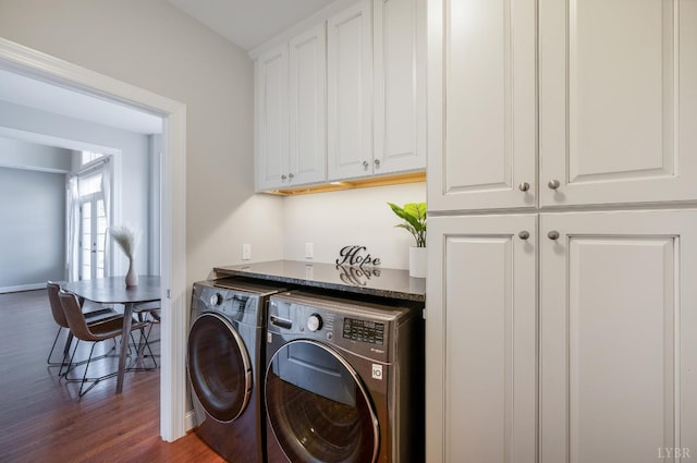 4802 Old Boonsboro Rd, Lynchburg, VA 24503 - clothes washing area featuring washing machine and dryer, cabinet space, dark wood-type flooring, and baseboards