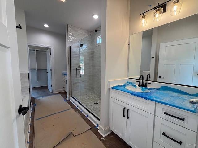 3 Live Oak Dr, Forest, VA 24551 - full bathroom with a stall shower, vanity, recessed lighting, and a walk in closet