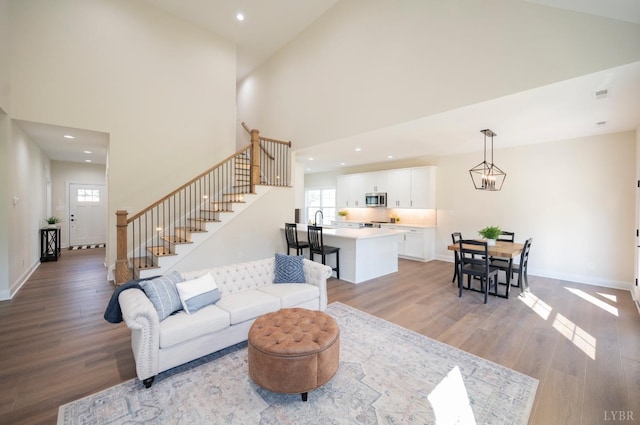 3 Live Oak Dr, Forest, VA 24551 - living area with plenty of natural light, light wood-type flooring, stairway, recessed lighting, and a high ceiling