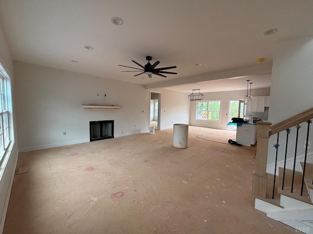 3 Live Oak Dr, Forest, VA 24551 - unfurnished living room with stairway, a ceiling fan, a fireplace, a chandelier, and recessed lighting