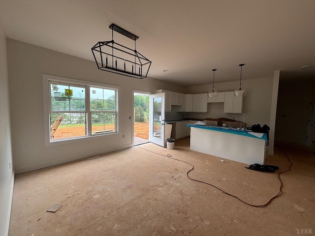 3 Live Oak Dr, Forest, VA 24551 - kitchen with white cabinetry, a kitchen island, and hanging light fixtures