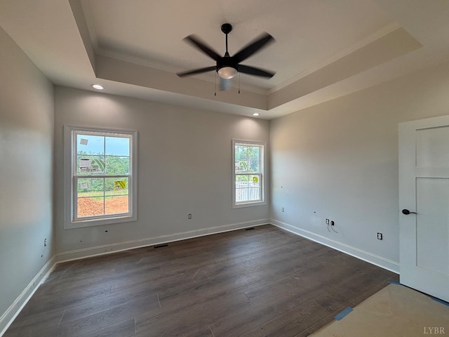 3 Live Oak Dr, Forest, VA 24551 - spare room featuring a tray ceiling, healthy amount of natural light, ceiling fan, dark wood finished floors, and crown molding