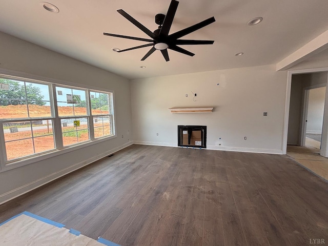 3 Live Oak Dr, Forest, VA 24551 - unfurnished living room with dark wood-style floors, a glass covered fireplace, a ceiling fan, and recessed lighting