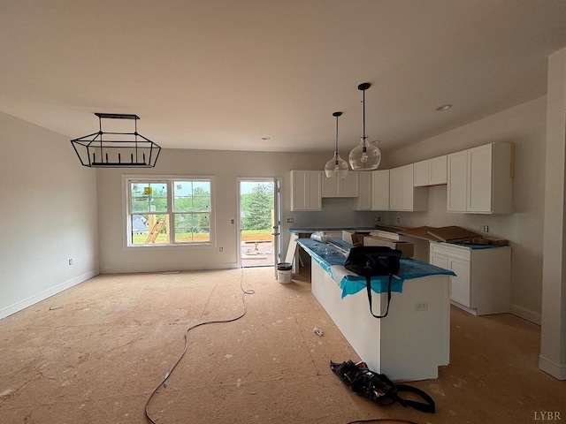 3 Live Oak Dr, Forest, VA 24551 - kitchen featuring a kitchen island, white cabinets, baseboards, and hanging light fixtures