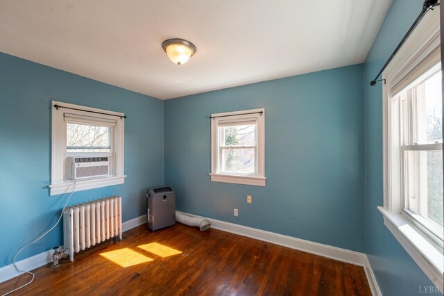 4610 Alabama Ave, Lynchburg, VA 24502 - spare room featuring baseboards, wood finished floors, radiator, and cooling unit
