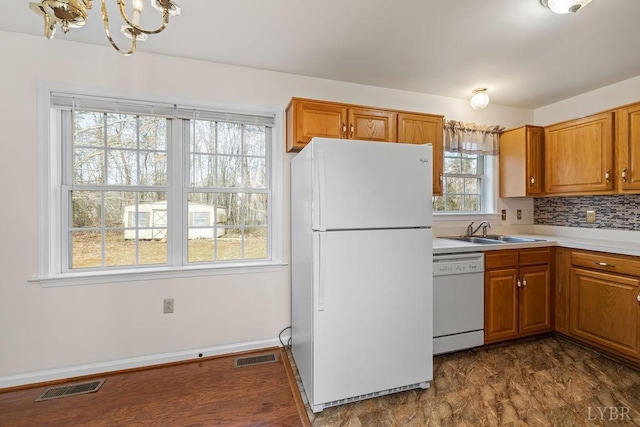 302 Pilot View Rd, Concord, VA 24538 - kitchen featuring white appliances, a sink, brown cabinets, and a chandelier