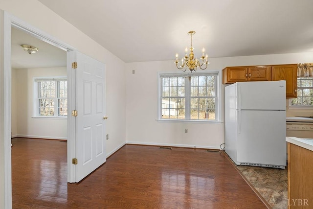 302 Pilot View Rd, Concord, VA 24538 - unfurnished dining area with a chandelier, dark wood-style flooring, plenty of natural light, and baseboards