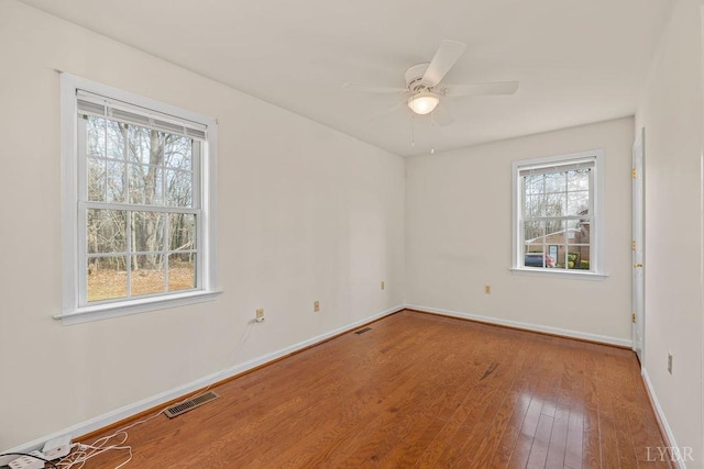 302 Pilot View Rd, Concord, VA 24538 - spare room featuring baseboards, wood finished floors, and a ceiling fan