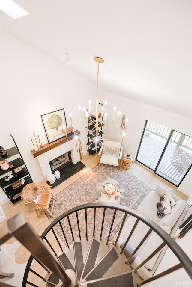 1926 Canterbury Ct Unit 301, Lynchburg, VA 24503 - stairs with a notable chandelier, wood finished floors, and a fireplace