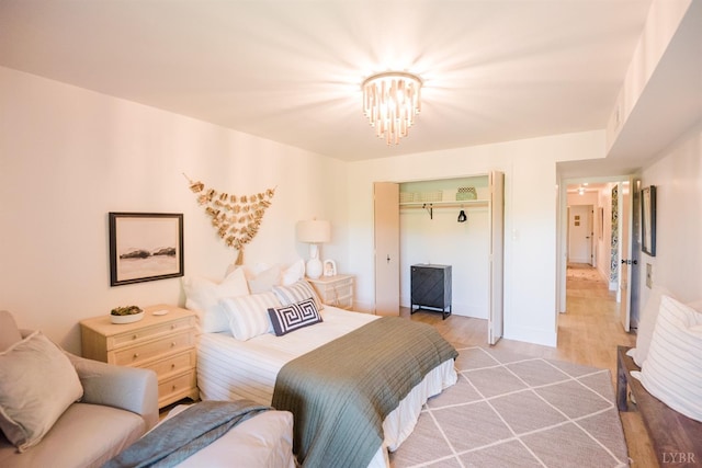 1926 Canterbury Ct Unit 301, Lynchburg, VA 24503 - bedroom featuring a closet, an inviting chandelier, and light wood-type flooring