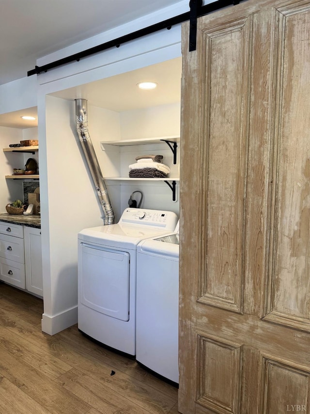 1926 Canterbury Ct Unit 301, Lynchburg, VA 24503 - clothes washing area with laundry area, a barn door, light wood-style flooring, and washer and dryer