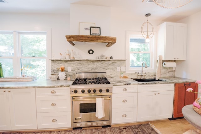 1926 Canterbury Ct Unit 301, Lynchburg, VA 24503 - kitchen featuring backsplash, white cabinetry, a sink, light stone counters, and luxury range