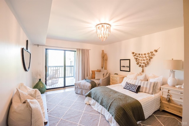 1926 Canterbury Ct Unit 301, Lynchburg, VA 24503 - bedroom featuring access to outside and an inviting chandelier