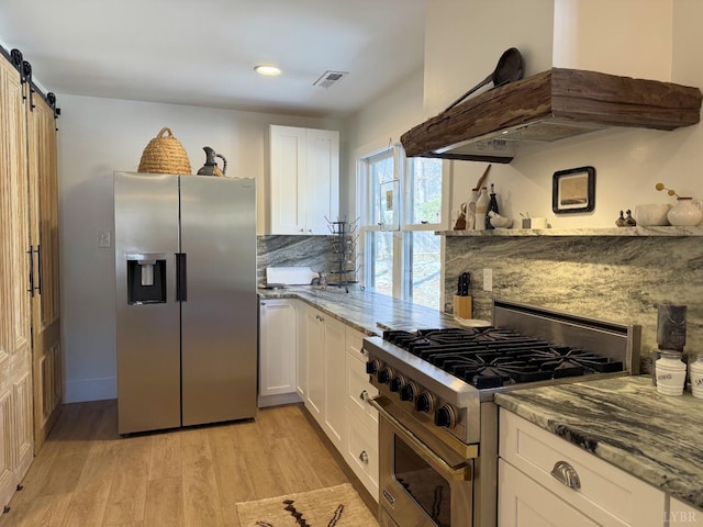 1926 Canterbury Ct Unit 301, Lynchburg, VA 24503 - kitchen featuring light wood-style floors, white cabinetry, extractor fan, and stainless steel appliances