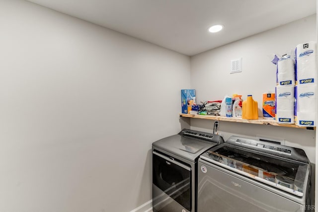 1038 Valencia Dr, Huddleston, VA 24101 - laundry room with washing machine and clothes dryer, baseboards, and recessed lighting