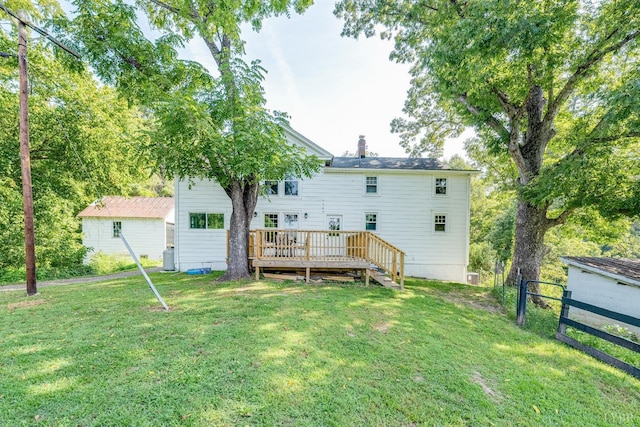 1038 Valencia Dr, Huddleston, VA 24101 - back of house with a deck and a chimney