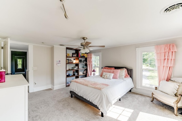 1038 Valencia Dr, Huddleston, VA 24101 - bedroom with multiple windows, light carpet, a ceiling fan, crown molding, and baseboards