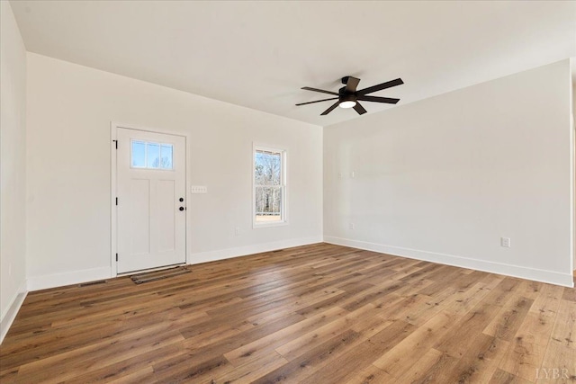 2802 Liberty Chapel Rd, Appomattox, VA 24522 - entrance foyer with wood finished floors, ceiling fan, and baseboards