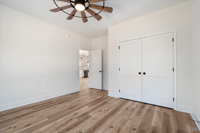 2802 Liberty Chapel Rd, Appomattox, VA 24522 - unfurnished bedroom featuring light wood finished floors, baseboards, and a closet