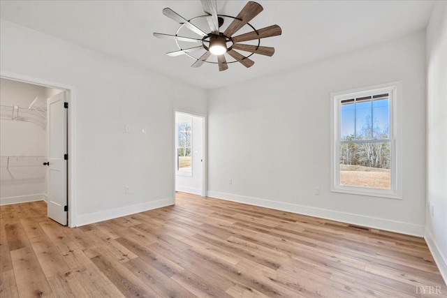 2802 Liberty Chapel Rd, Appomattox, VA 24522 - unfurnished room with plenty of natural light, light wood-type flooring, baseboards, and a ceiling fan