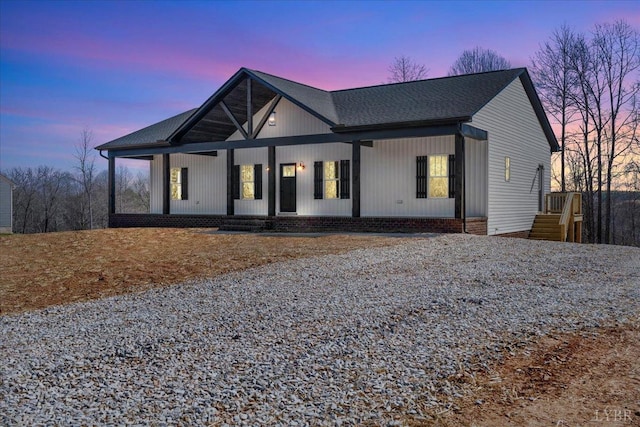 2802 Liberty Chapel Rd, Appomattox, VA 24522 - modern farmhouse with covered porch, gravel driveway, and roof with shingles