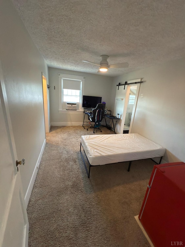 318 Westover Blvd, Lynchburg, VA 24501 - bedroom with a barn door, ceiling fan, a textured ceiling, and carpet flooring