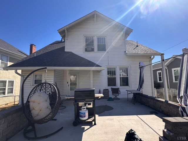318 Westover Blvd, Lynchburg, VA 24501 - rear view of house featuring fence, a patio, and a shingled roof