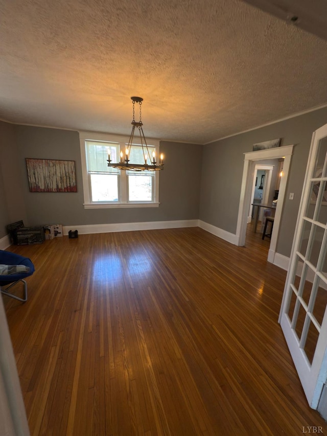 318 Westover Blvd, Lynchburg, VA 24501 - unfurnished dining area with dark wood-style floors, a textured ceiling, and an inviting chandelier