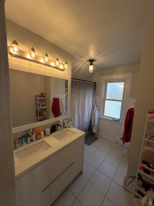 318 Westover Blvd, Lynchburg, VA 24501 - full bathroom featuring toilet, double vanity, a sink, and tile patterned floors