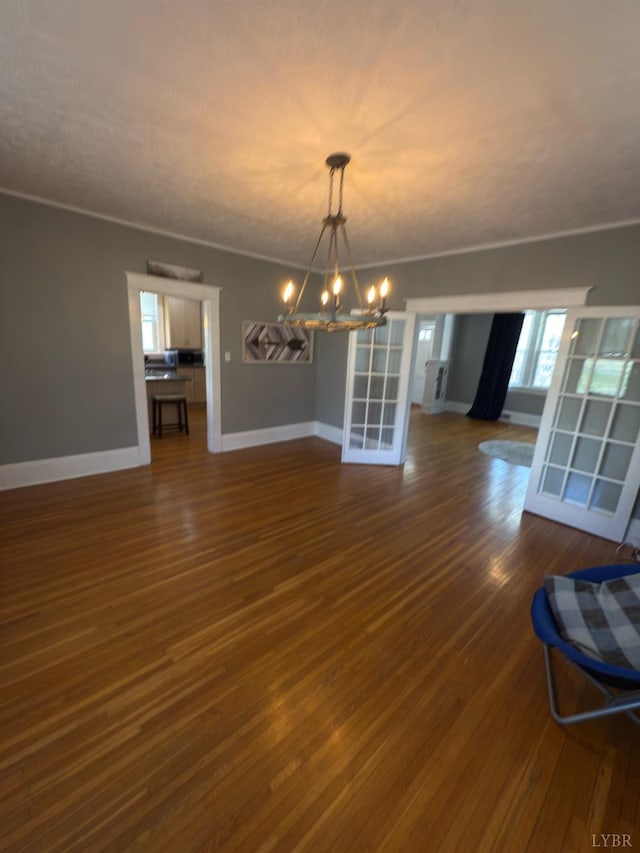 318 Westover Blvd, Lynchburg, VA 24501 - unfurnished dining area with a chandelier, dark wood-style floors, and baseboards