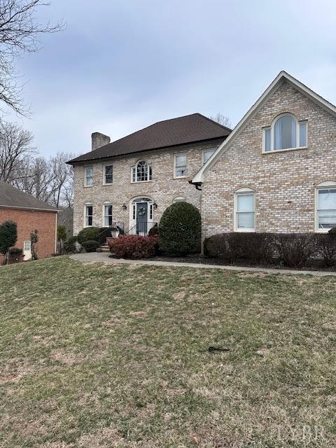 3567 Gregory Ln, Lynchburg, VA 24503 - view of front of property featuring a chimney, a front yard, and brick siding