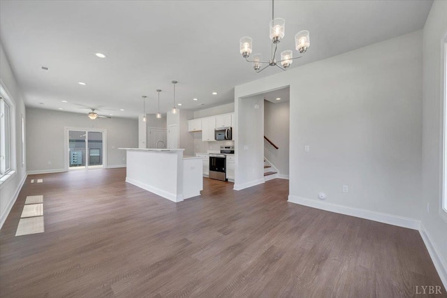 38 Shotman Rd, Rustburg, VA 24502 - kitchen featuring appliances with stainless steel finishes, open floor plan, white cabinets, ceiling fan, and dark wood-type flooring